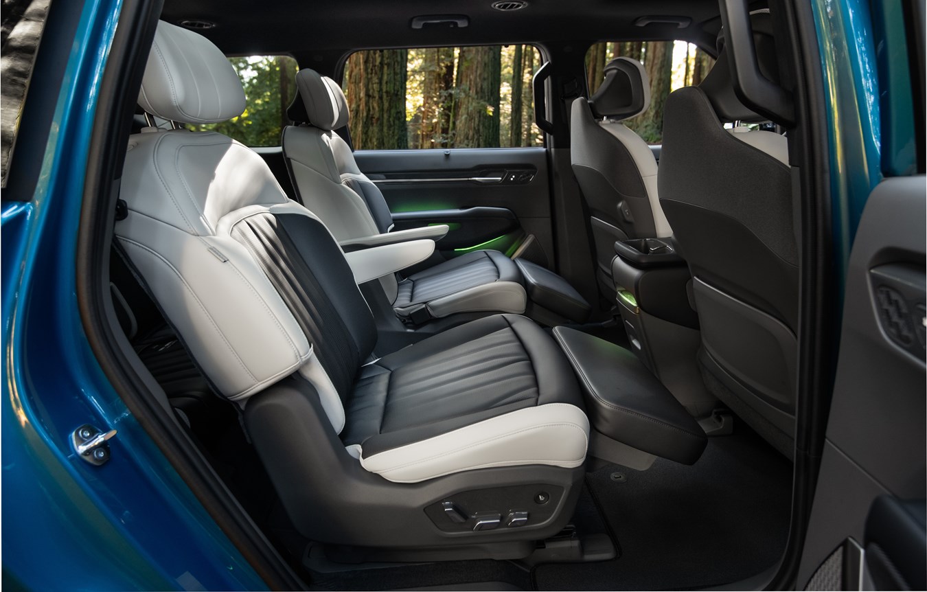 Official Kia EV9 interior image showing the second-row relaxation captain's chairs