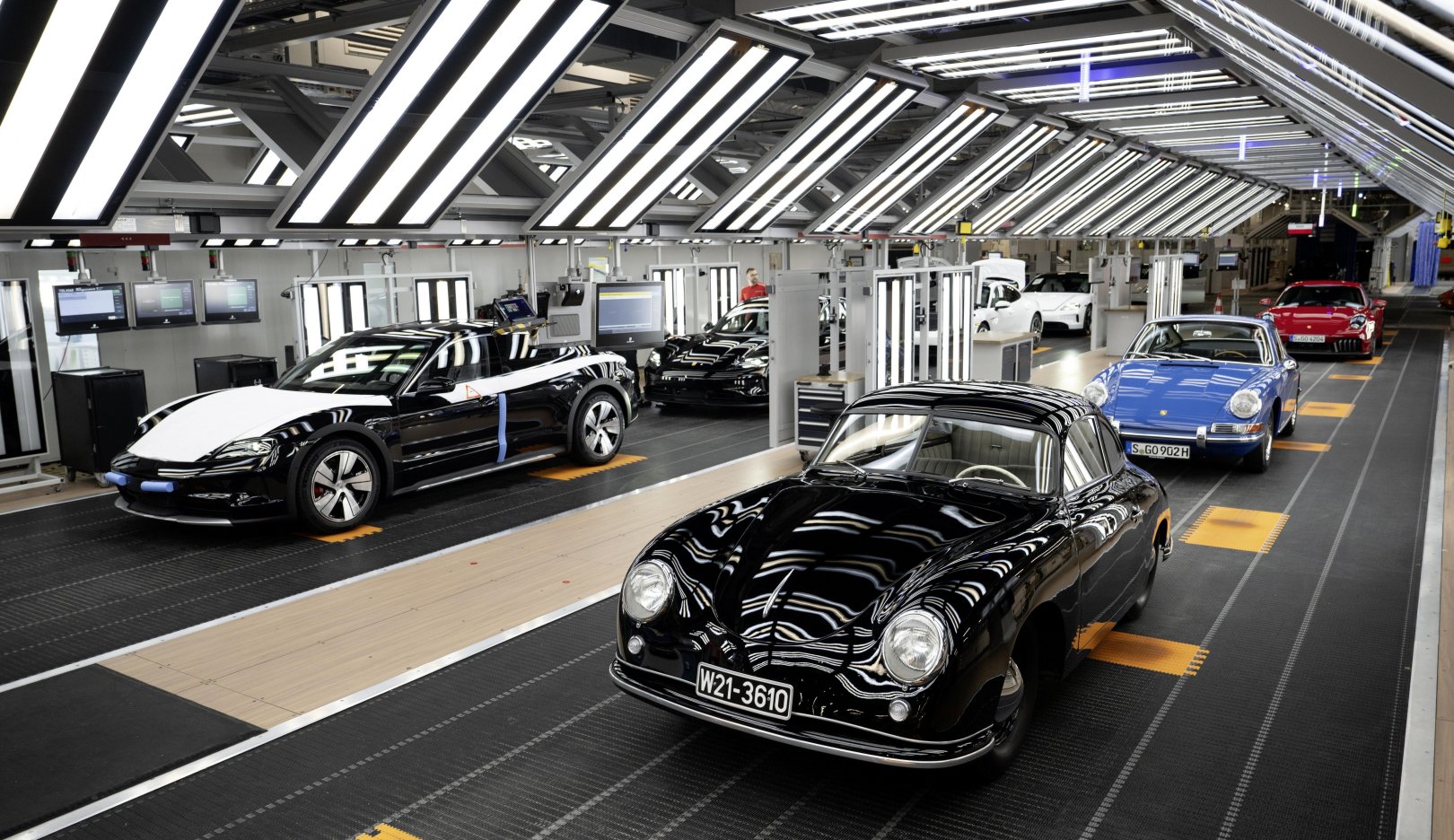 Official Porsche image showing Taycan and 911 production at the Zuffenhausen factory