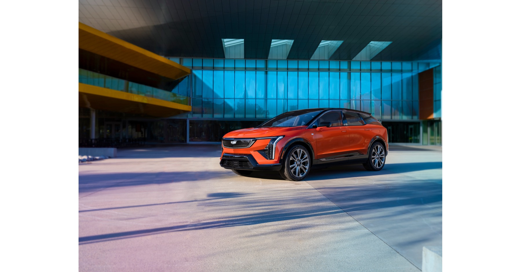 Orange 2026 Cadillac OPTIQ electric SUV in official GM Canada imagery