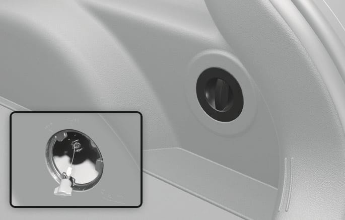 Hyundai manual illustration locating the charging-connector emergency cable at the right side of the luggage area