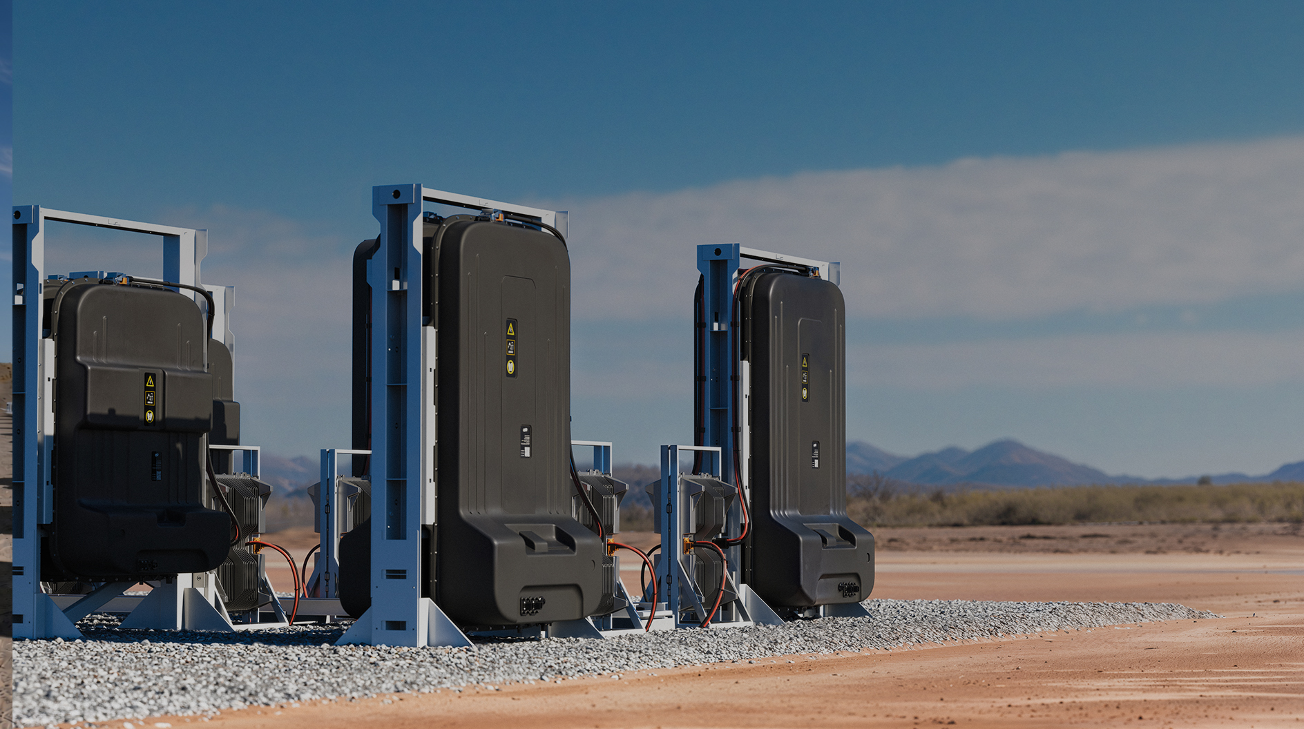 Redwood Materials official photograph of EV battery packs mounted upright in outdoor stationary-storage racks
