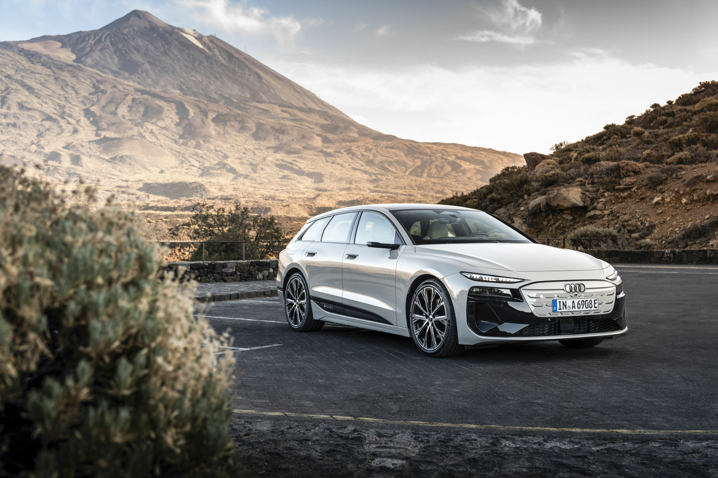 Audi A6 Avant e-tron front three-quarter official image in a mountain landscape