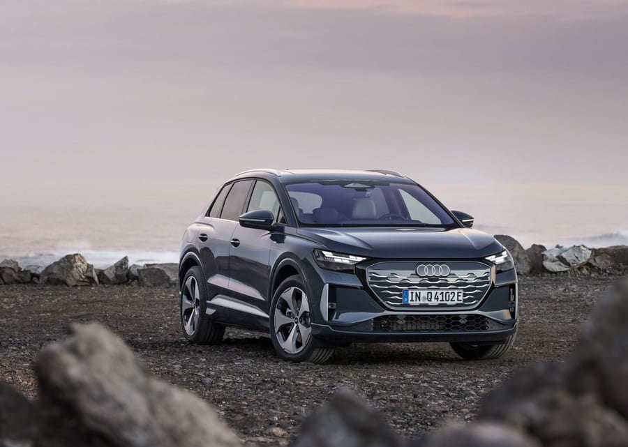 Audi Q4 SUV e-tron front three-quarter view on rocky terrain