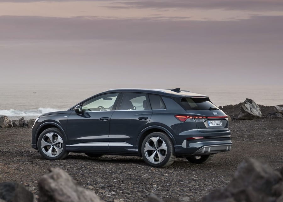 Audi Q4 SUV e-tron rear three-quarter view on rocky terrain