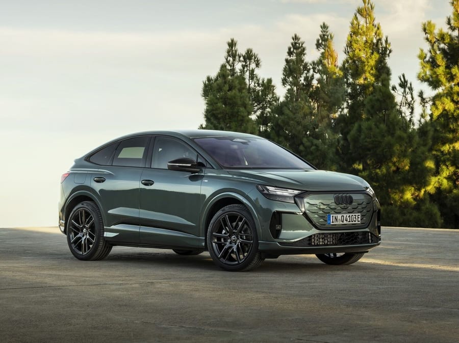 Audi Q4 Sportback e-tron front three-quarter view in a driveway