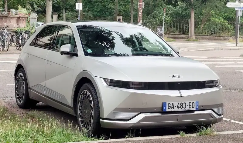 EV owner plugging in home Level 2 charger