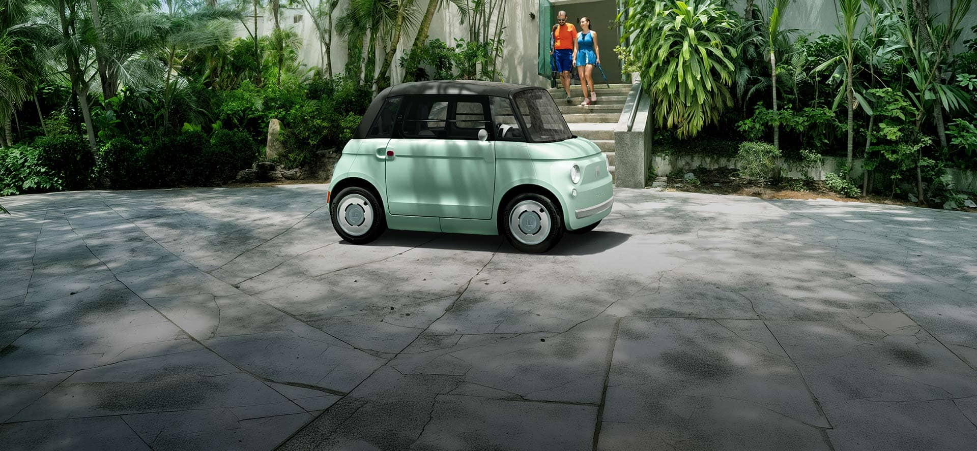 Official Fiat USA image of a mint green Fiat Topolino near a tennis club