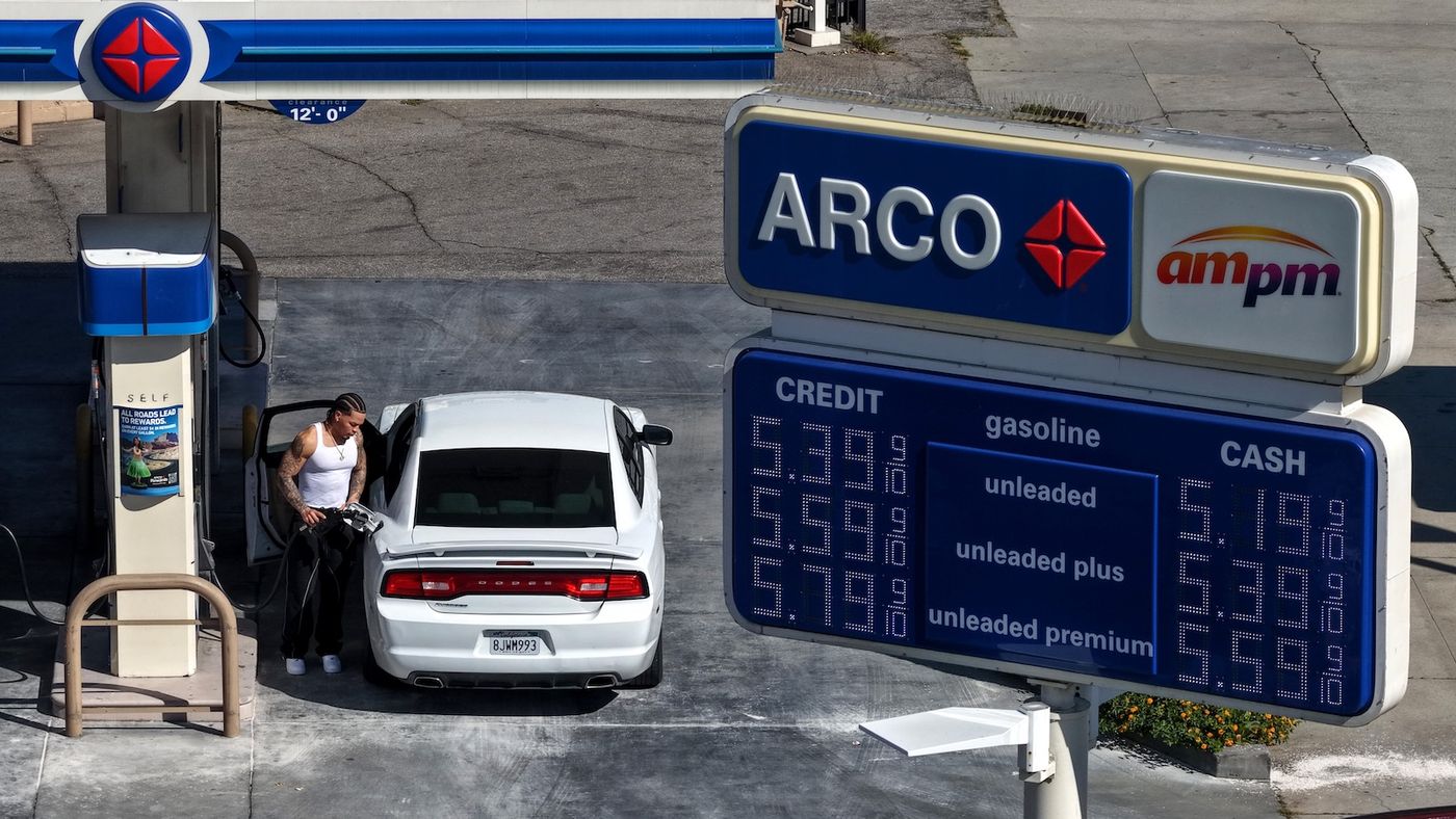 Gas pump showing rising fuel prices, representing the $4/gallon moment driving EV interest