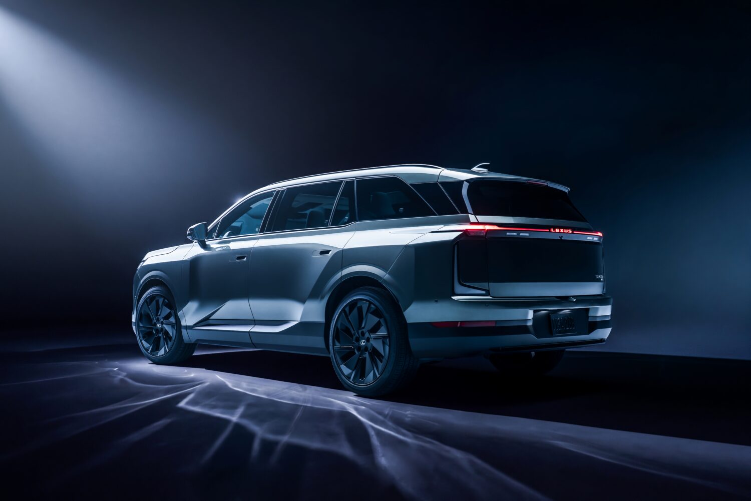 Official Lexus image of the 2027 Lexus TZ electric SUV in a rear three-quarter studio view