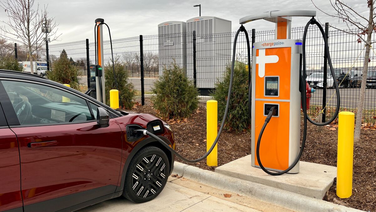 Nissan Leaf electric vehicle charging at a public charging station