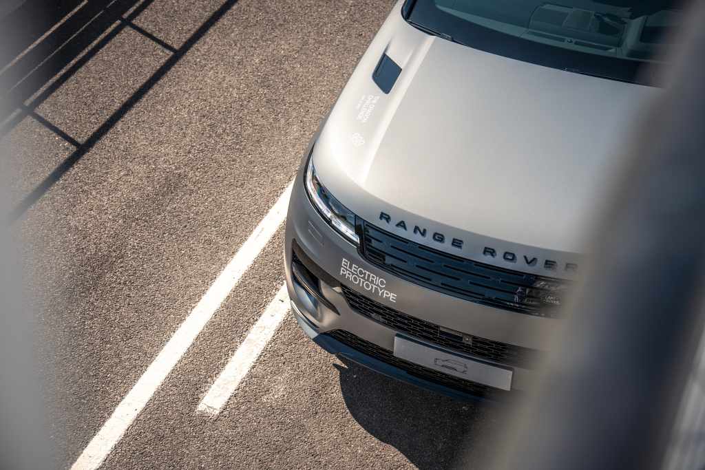 Official overhead image of a silver Range Rover Sport Electric prototype at Goodwood Motor Circuit
