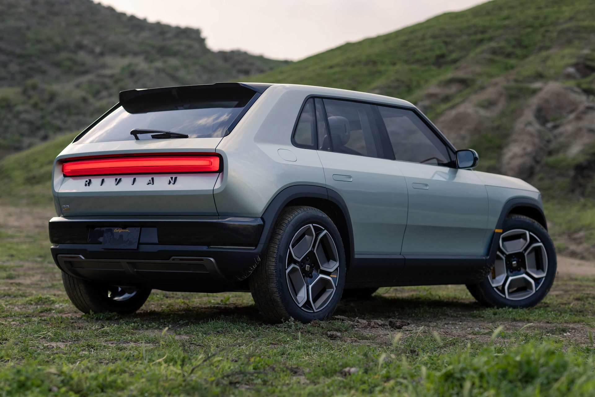 Official Rivian rear three-quarter view of the R3 electric crossover
