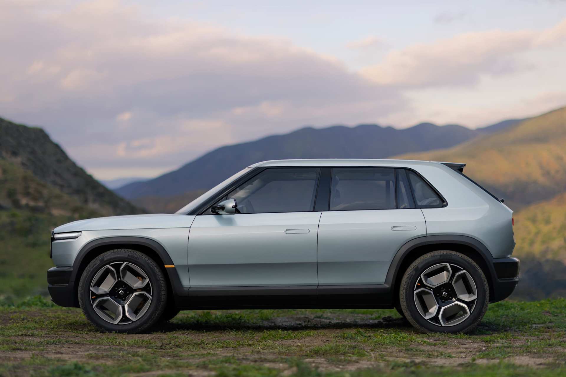 Official Rivian side view of the R3's compact hatchback-style body