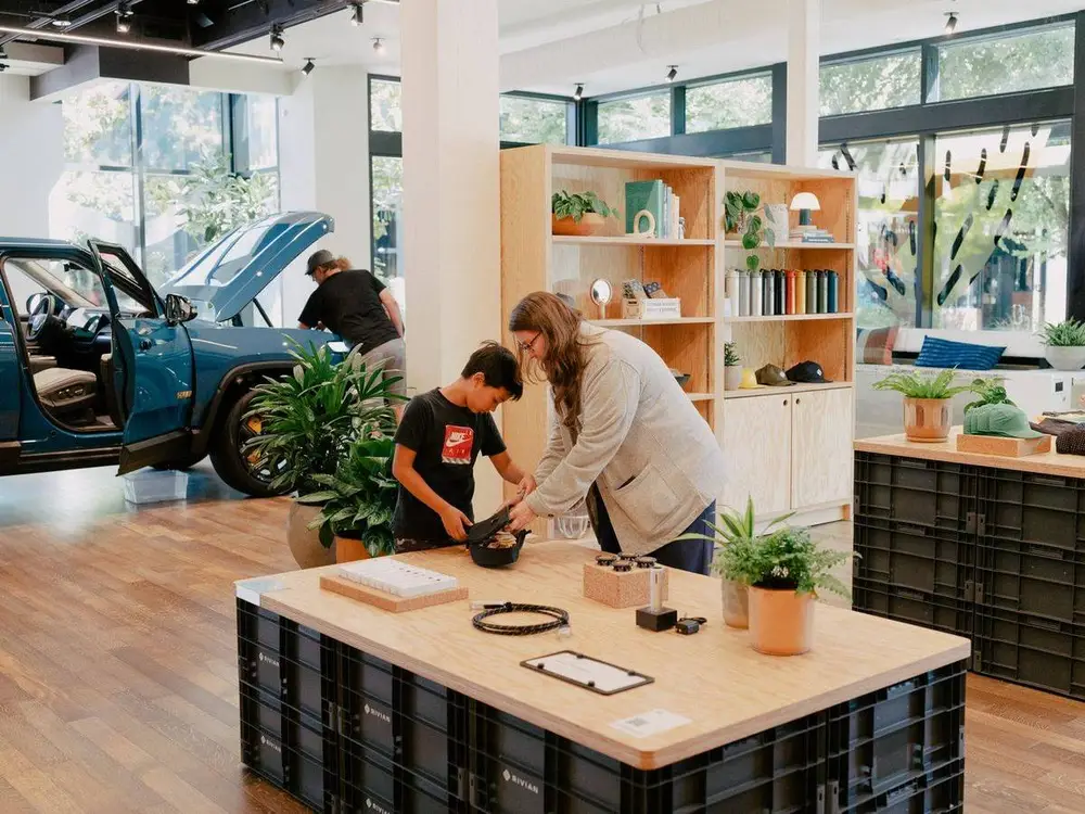 Rivian R1S in Rivian Blue at a charging station