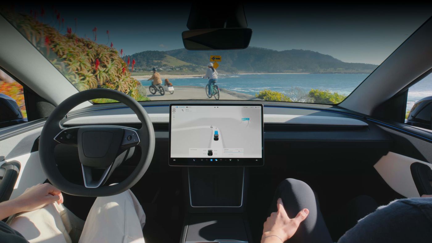 Tesla vehicle with FSD visualization on screen