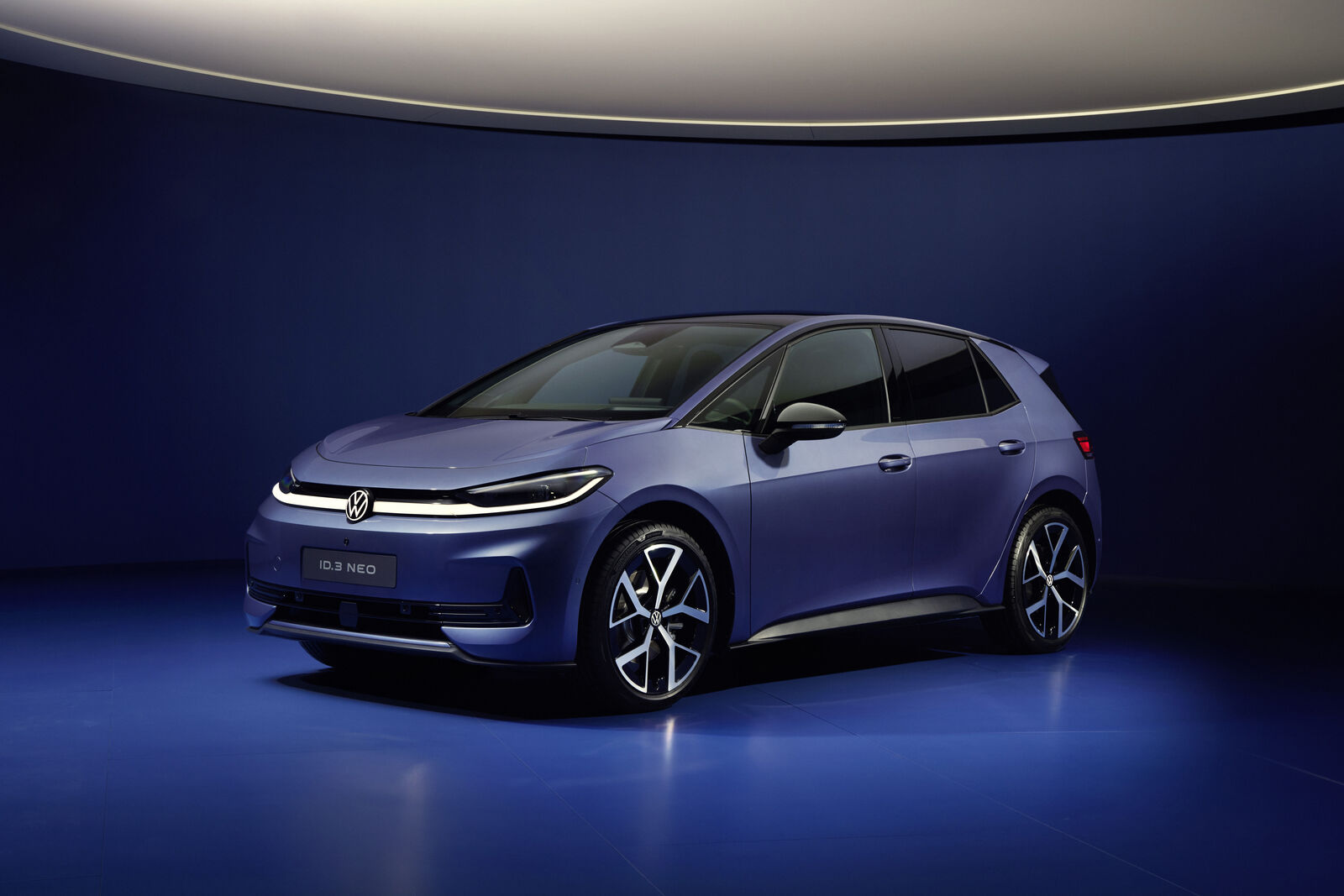 Volkswagen ID.3 Neo in a blue-lit studio during its official launch presentation